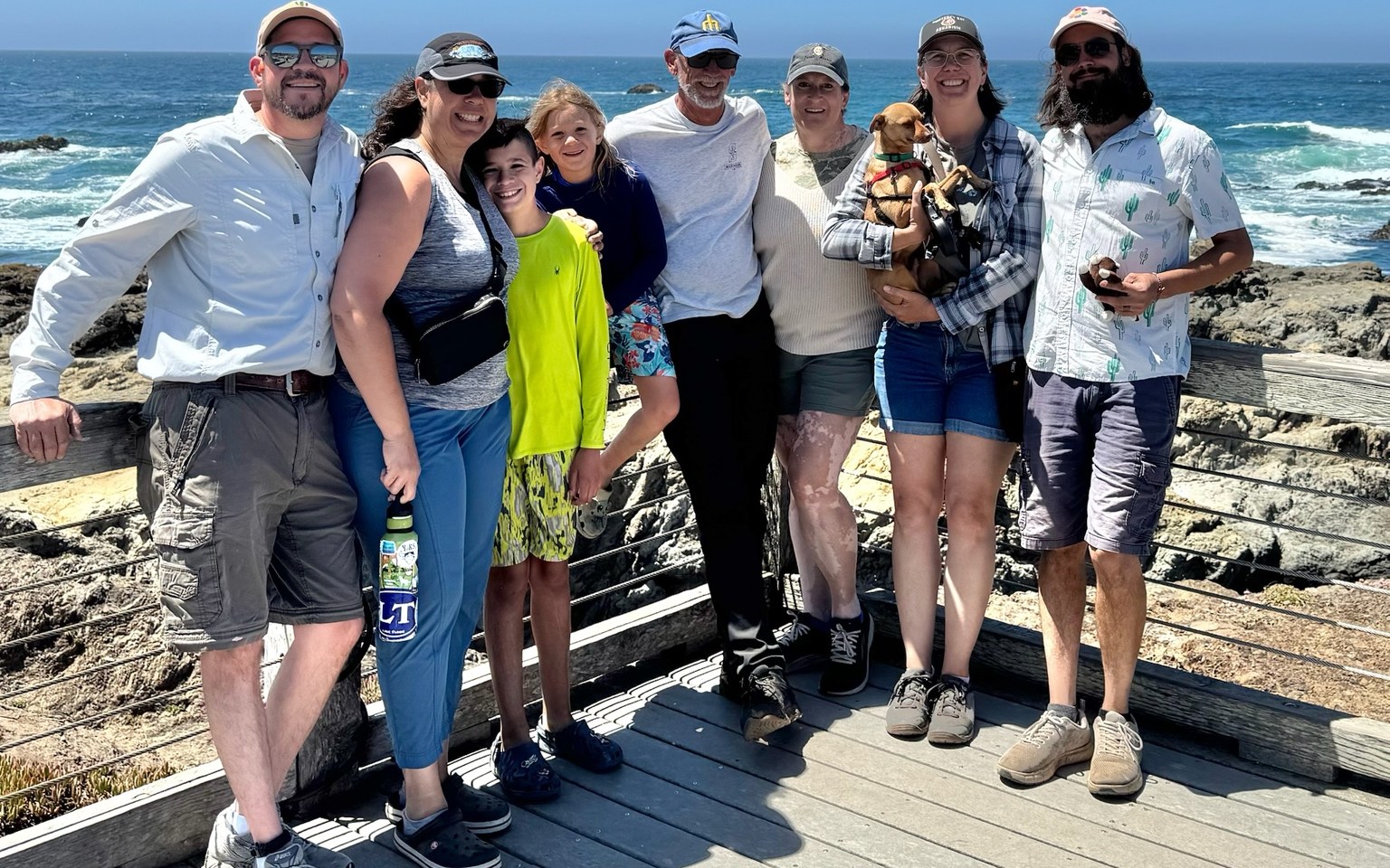 Extended family group at a rocky coastal overlook