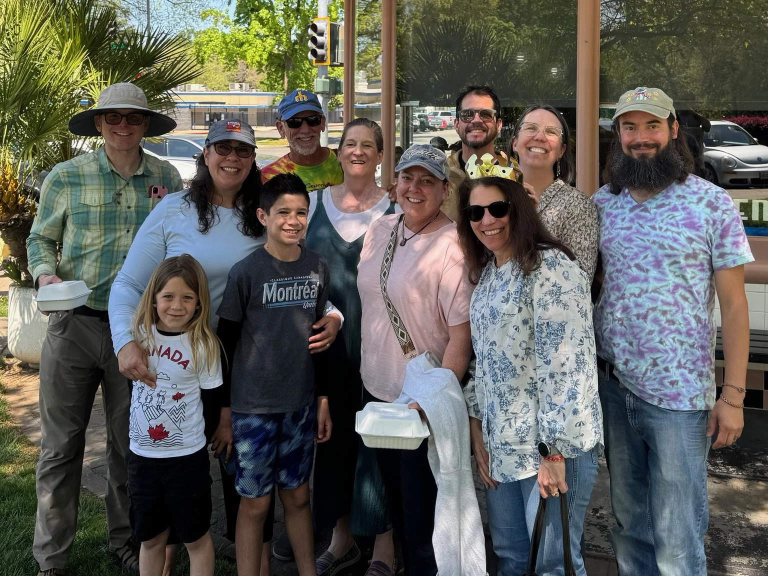 Randall Stone standing with a community group outdoors
