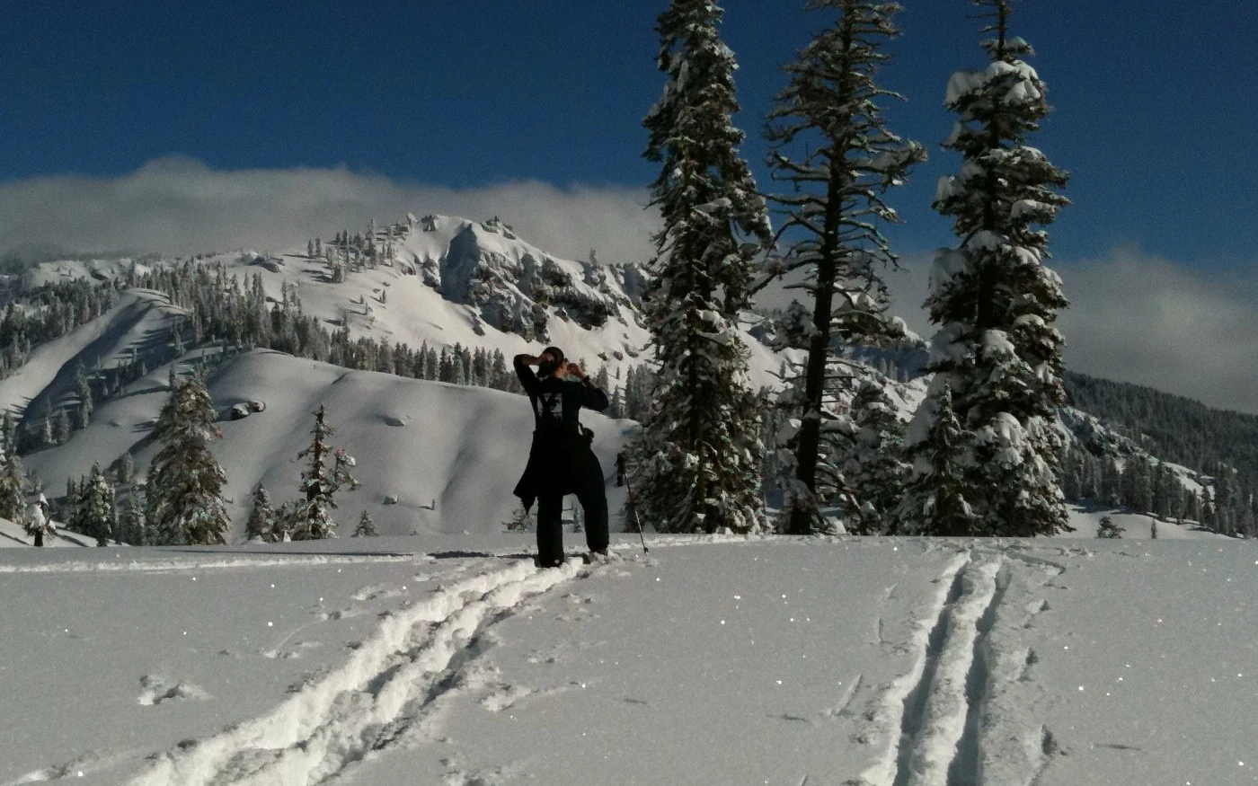 Krista Stone in Lassen Volcanic National Park on a clear morning after a snowstorm camp