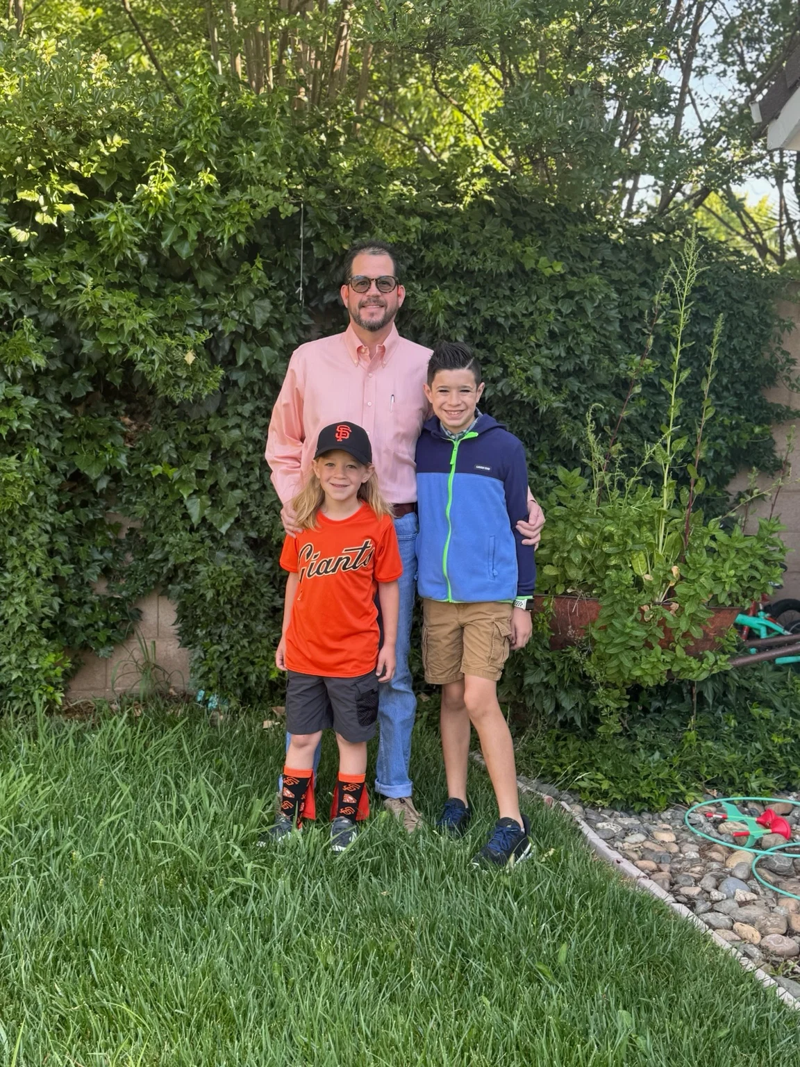 Randall Stone outdoors with his two children