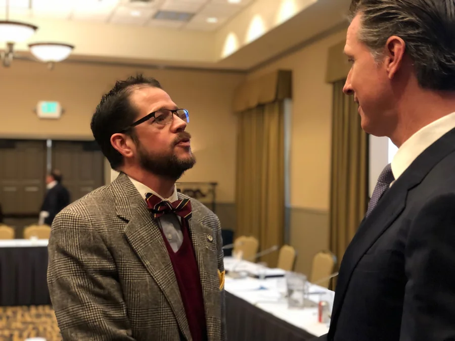 Randall Stone speaking with Gavin Newsom at the League of California Cities Board of Directors meeting in Grass Valley in February 2019