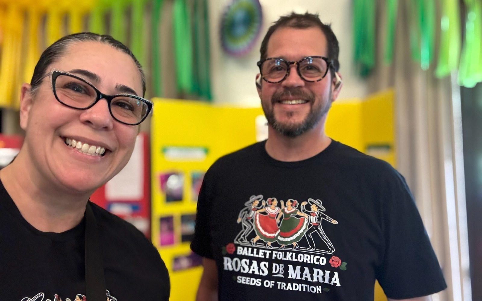Krista Stone and Randall Stone wearing Rosas de María shirts